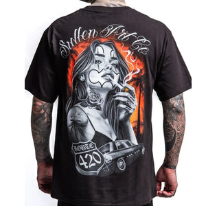 Black t-shirt with a graphic design of a woman smoking a cigarette and Route 420 text, worn by a person with tattoos.