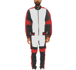 Person wearing a black, white, and red jumpsuit on a white background