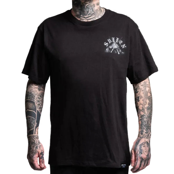Black t-shirt with a logo worn by a person with tattoos on a white background