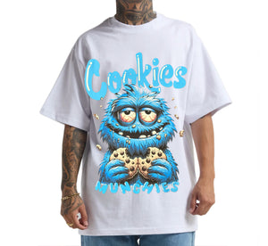 Person wearing a white t-shirt with a blue creature graphic and 'Cookies' text.