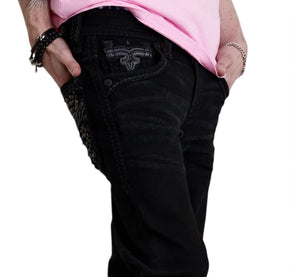 Person wearing black jeans and a pink top on a white background