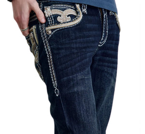 Close-up of dark blue jeans with decorative stitching on a white background