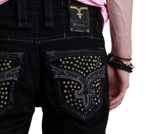 Black studded pants with a brand logo on a white background