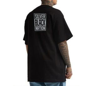 Person wearing a black t-shirt with 'Silver Black Nation' text on the back, standing against a white background.