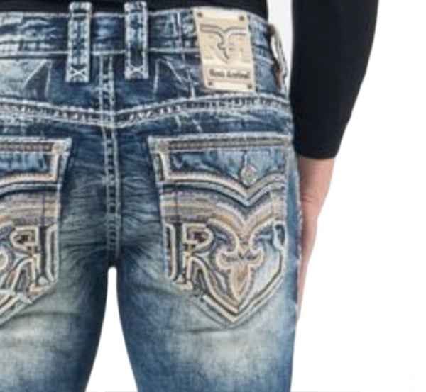 Close-up of blue jeans with a Rock Revival logo on the pocket against a white background
