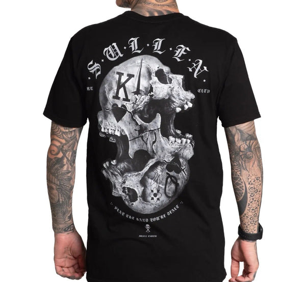 Sullen Black t-shirt with skull design and text worn by a person with tattoos.