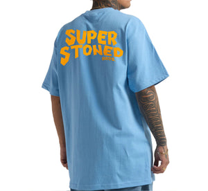 Light blue t-shirt with 'Super Stoned' text on the back, worn by a person.