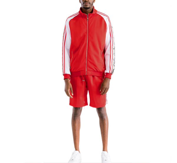 Person wearing a red tracksuit with white stripes on a white background